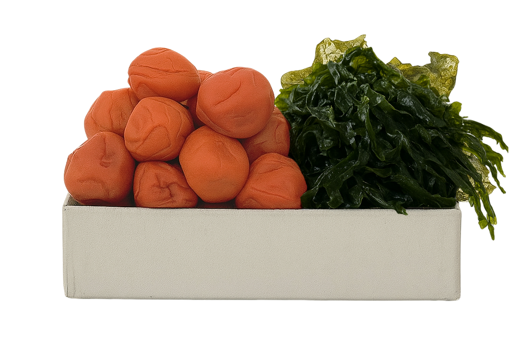 Box with pickled plums and seaweed on a white background